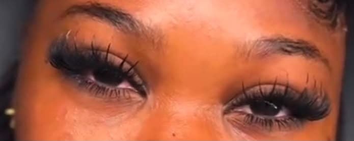 Full volume lash extensions on both eyes, long and densely fanned with a wispy tip