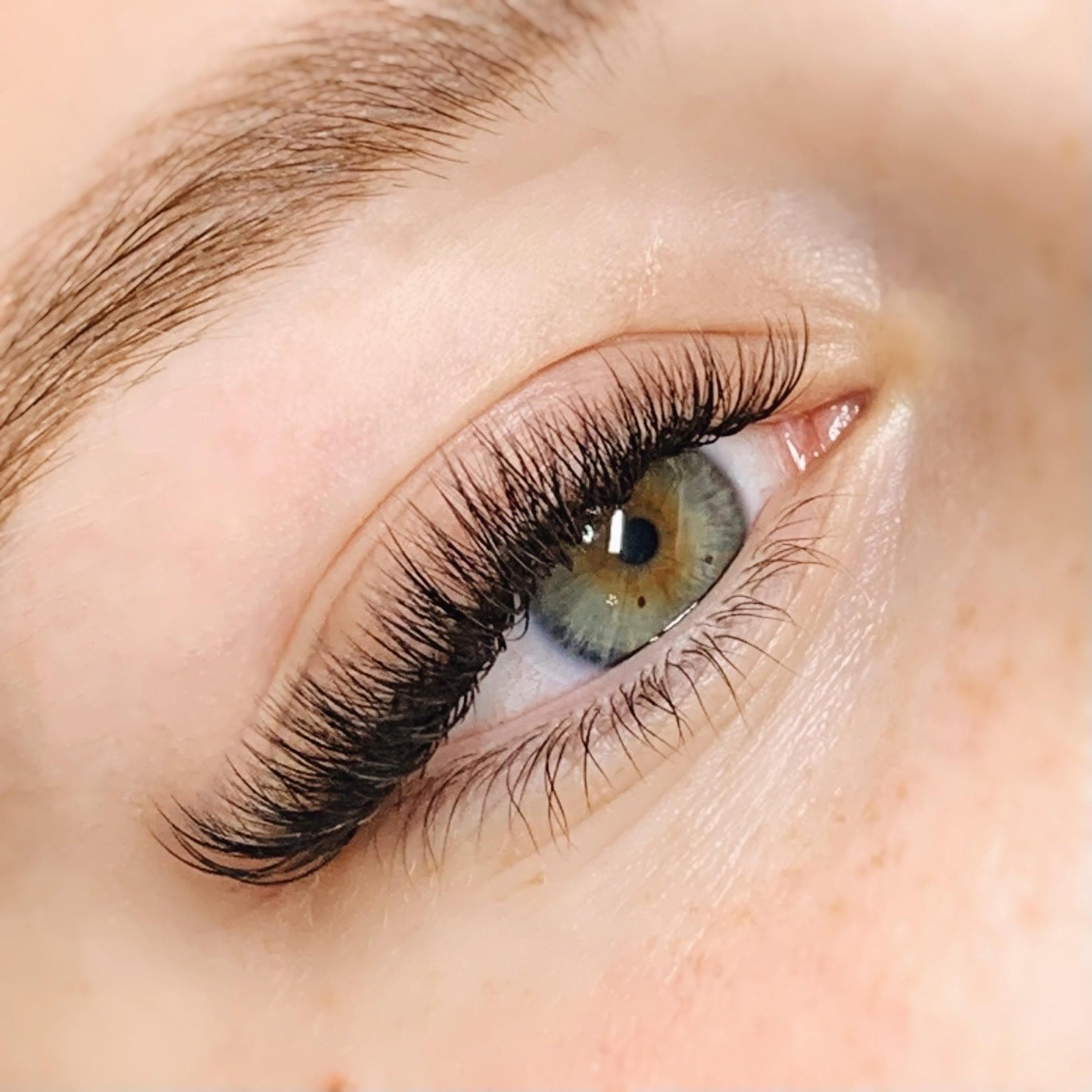 A close-up of lash extensions applied along the lash line
